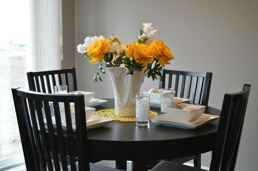 Round and rectangular oak dining tables styled in a modern British dining room