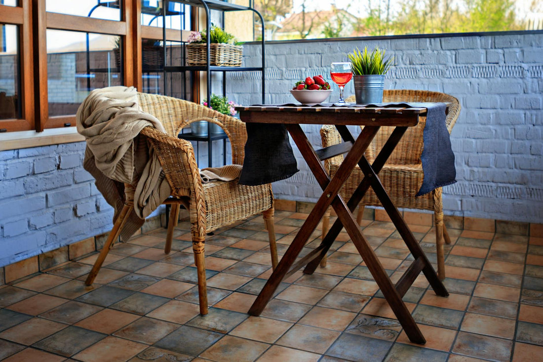 Compact garden dining table styled on a small British patio with outdoor seating